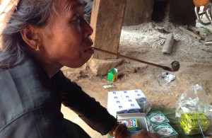 Woman smoking a pipe tea blog